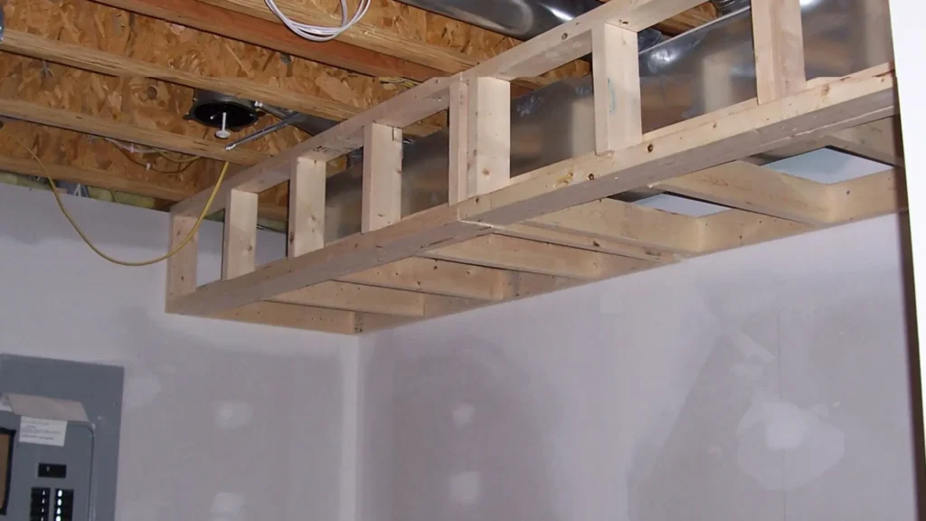Basement ceiling bulkhead framing above new drywall during a basement conversion