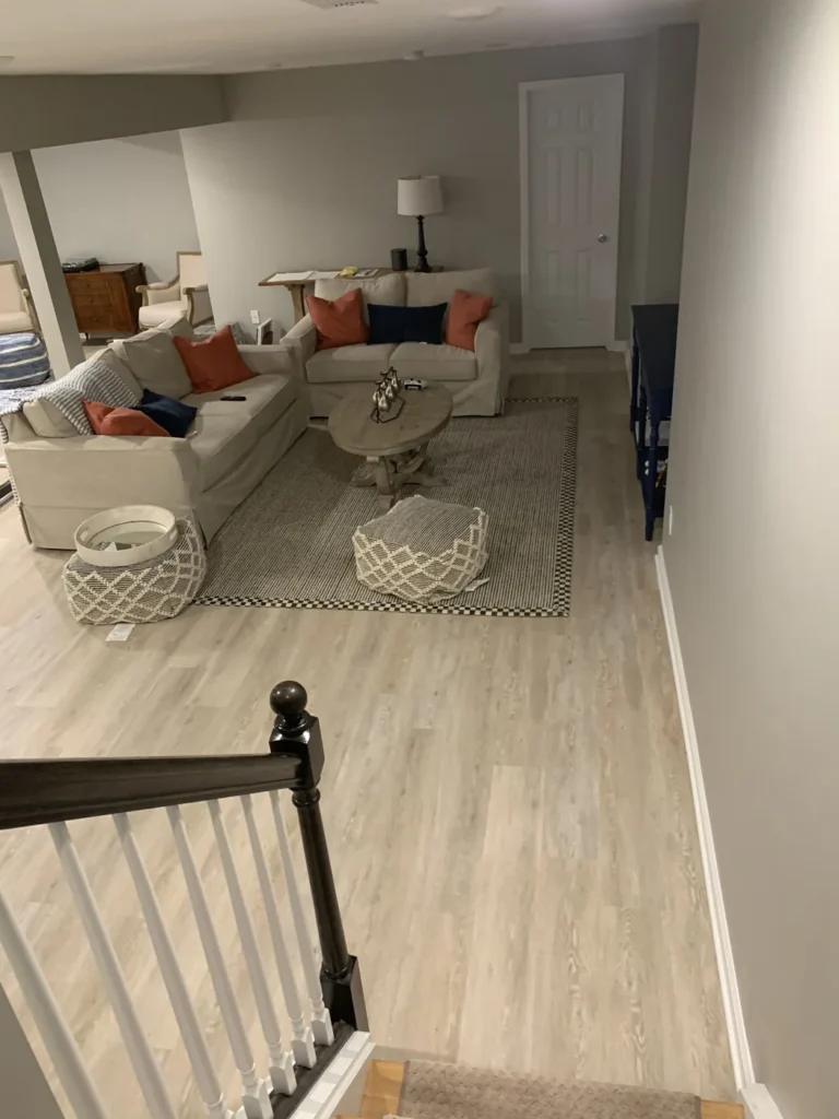 Finished basement living area with light plank flooring, Kanata, Ottawa