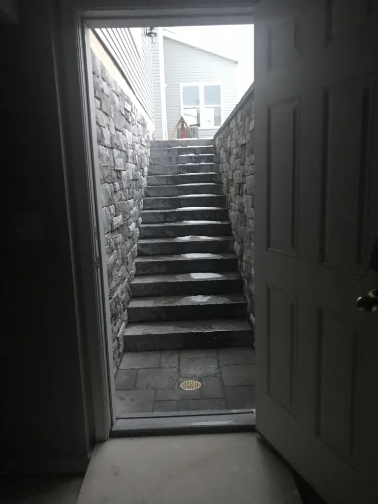 Stone stairwell leading up from a lower-level unit entrance, Manotick, Ottawa