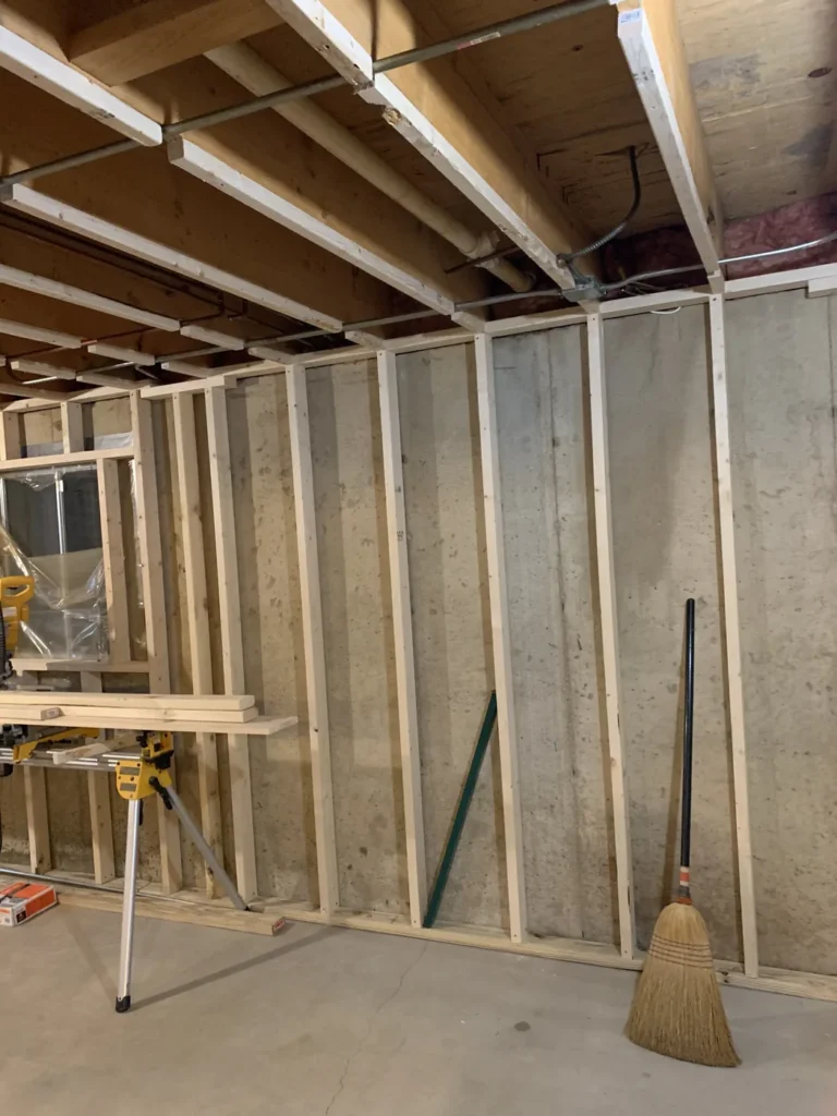 Basement framing along the poured foundation wall, Riverside South, Ottawa